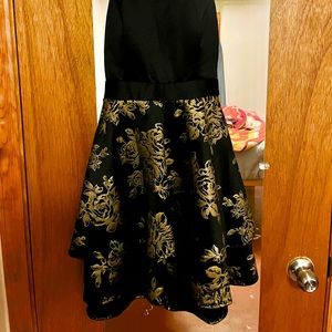 What:  black Hoco dress with gold flower accents